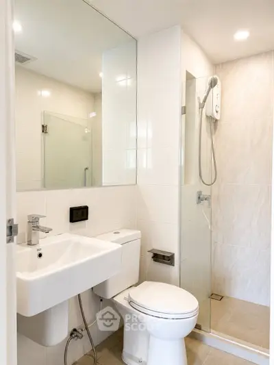 Modern bathroom with sleek fixtures and glass shower enclosure
