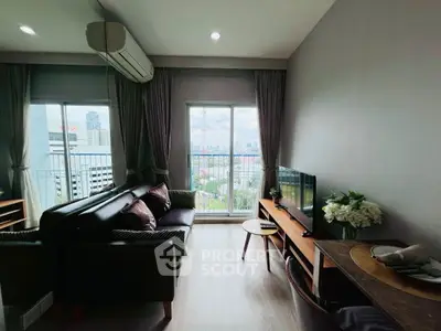 Modern living room with city view and balcony access