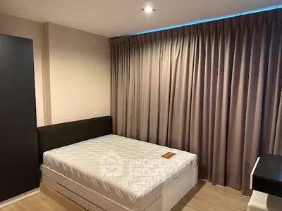 Cozy bedroom with modern design and ample natural light