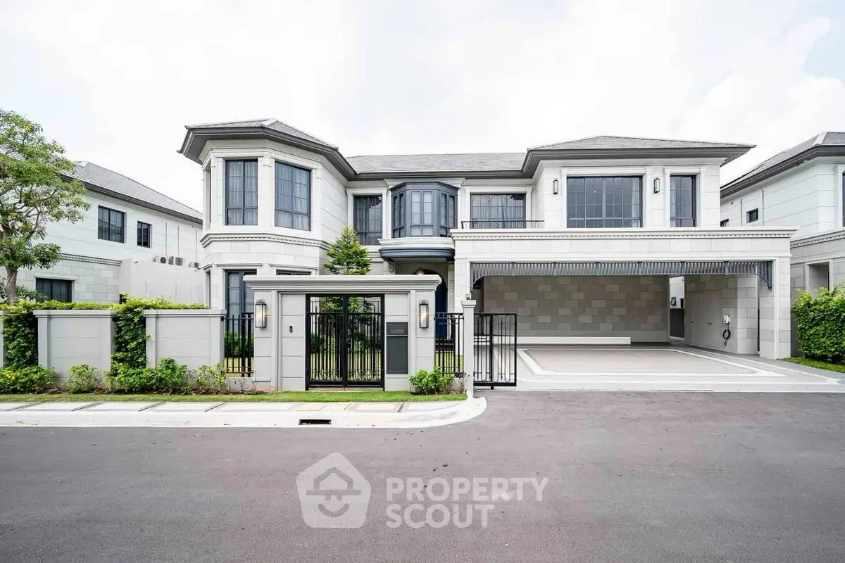 Luxurious modern mansion with spacious driveway and elegant facade in upscale neighborhood.
