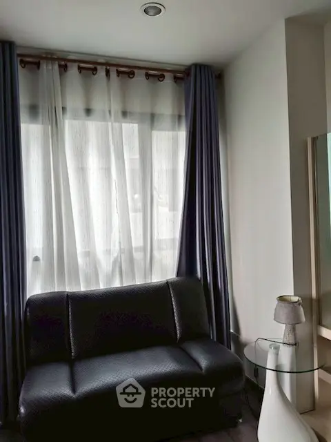 Cozy living room with modern sofa and stylish curtains