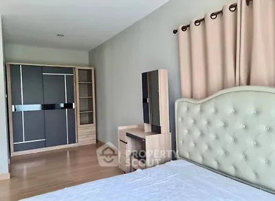 Spacious bedroom with modern furniture and elegant decor