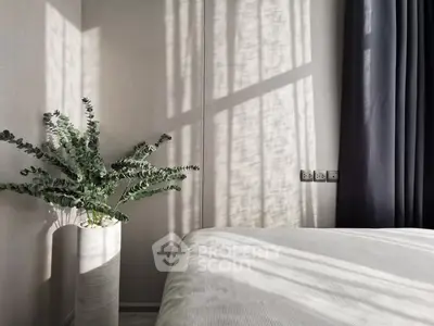 Serene bedroom with natural light and elegant decor