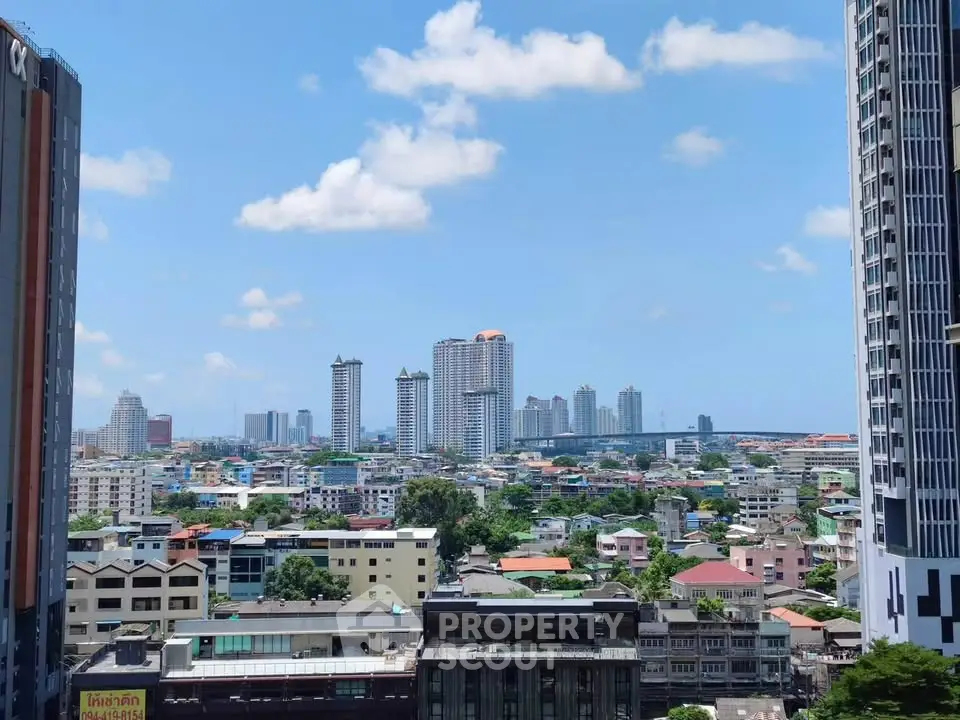 Stunning cityscape view with high-rise buildings and clear blue sky.