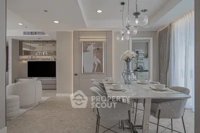 Luxurious open-plan living and dining area with elegant decor and modern furnishings.