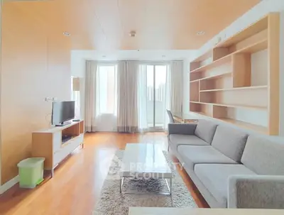 Spacious modern living room with large windows and stylish furniture