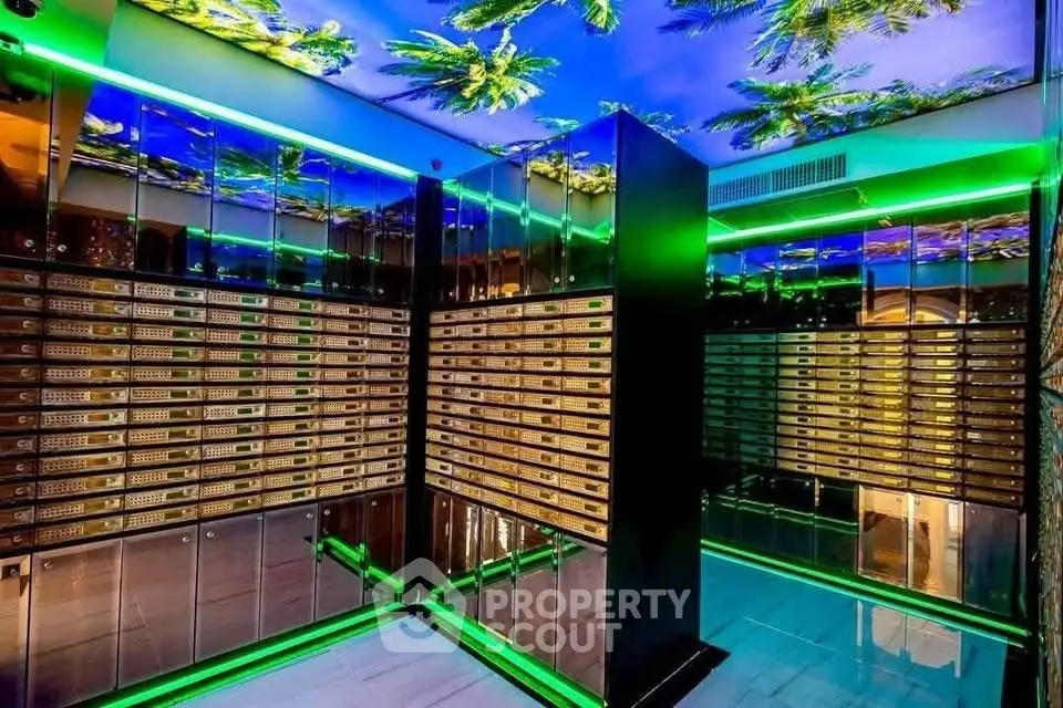 Luxurious modern elevator with mirrored walls and vibrant ceiling design