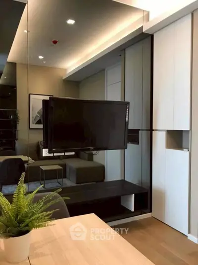 Modern living room with sleek TV setup and stylish decor