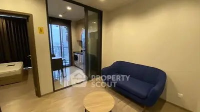 Modern apartment interior with cozy living room and kitchen view