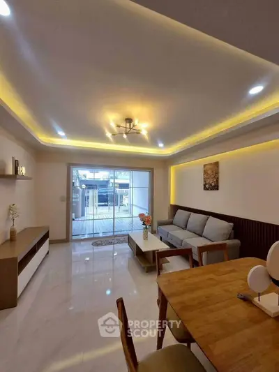 Modern living room with elegant lighting and spacious design