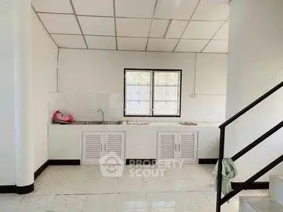 Spacious kitchen with minimalist design and ample natural light