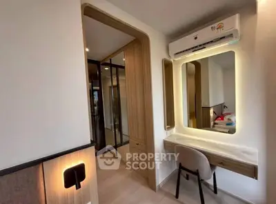 Modern bedroom with stylish vanity and air conditioning