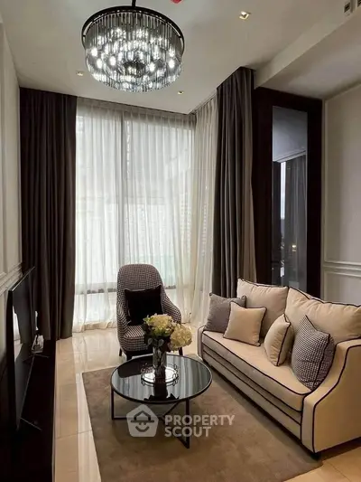 Elegant living room with modern chandelier and stylish furniture