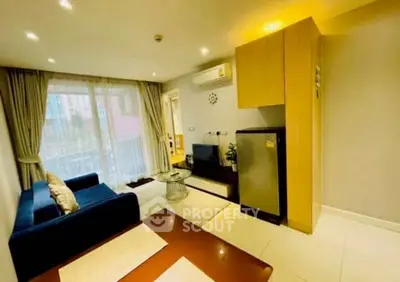 Modern living room with cozy sofa and stylish decor in a bright apartment.
