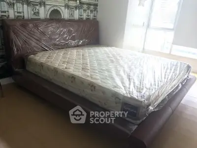 Spacious bedroom with a new mattress and stylish headboard, perfect for comfort and relaxation.