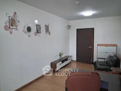 Modern living room with stylish decor and comfortable seating in a cozy apartment.