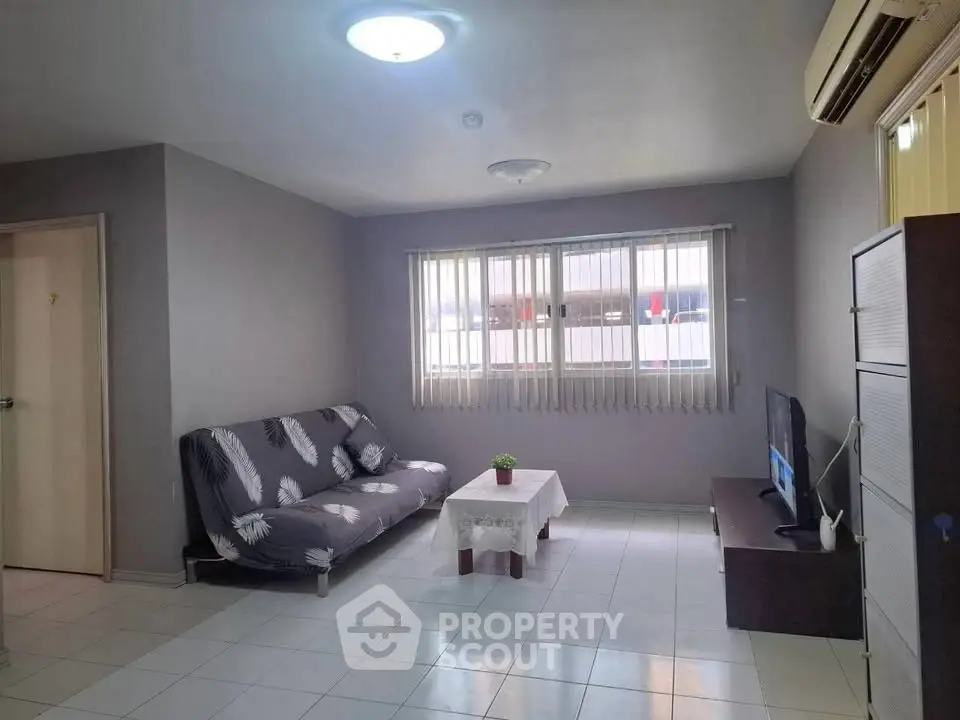 Spacious living room with modern decor and natural light