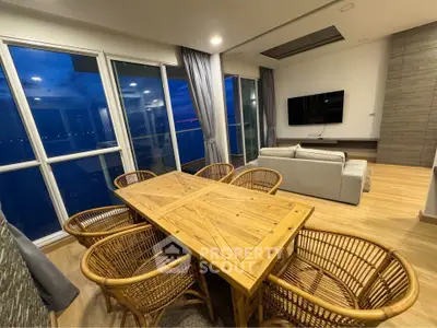 Luxurious living room with panoramic windows and elegant wooden dining set