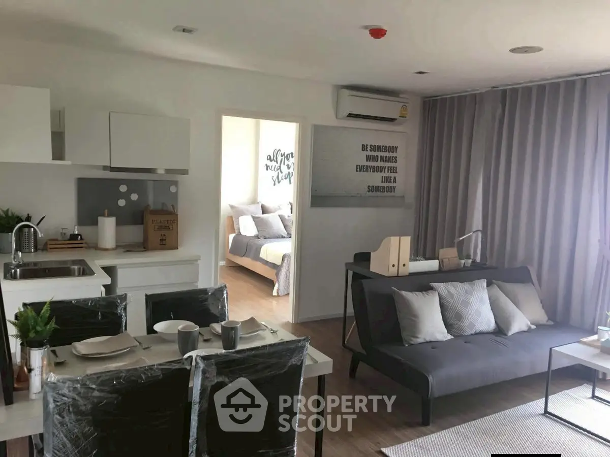 Modern open-plan living room with stylish decor and cozy ambiance