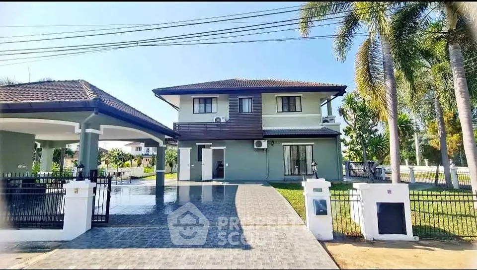 Stunning two-story house with spacious driveway and lush garden, perfect for family living in a serene neighborhood.