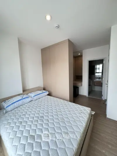 Modern bedroom with cozy bed and built-in wardrobe in a stylish apartment
