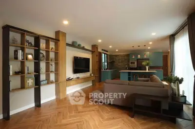 Spacious modern living room with open kitchen and stylish decor