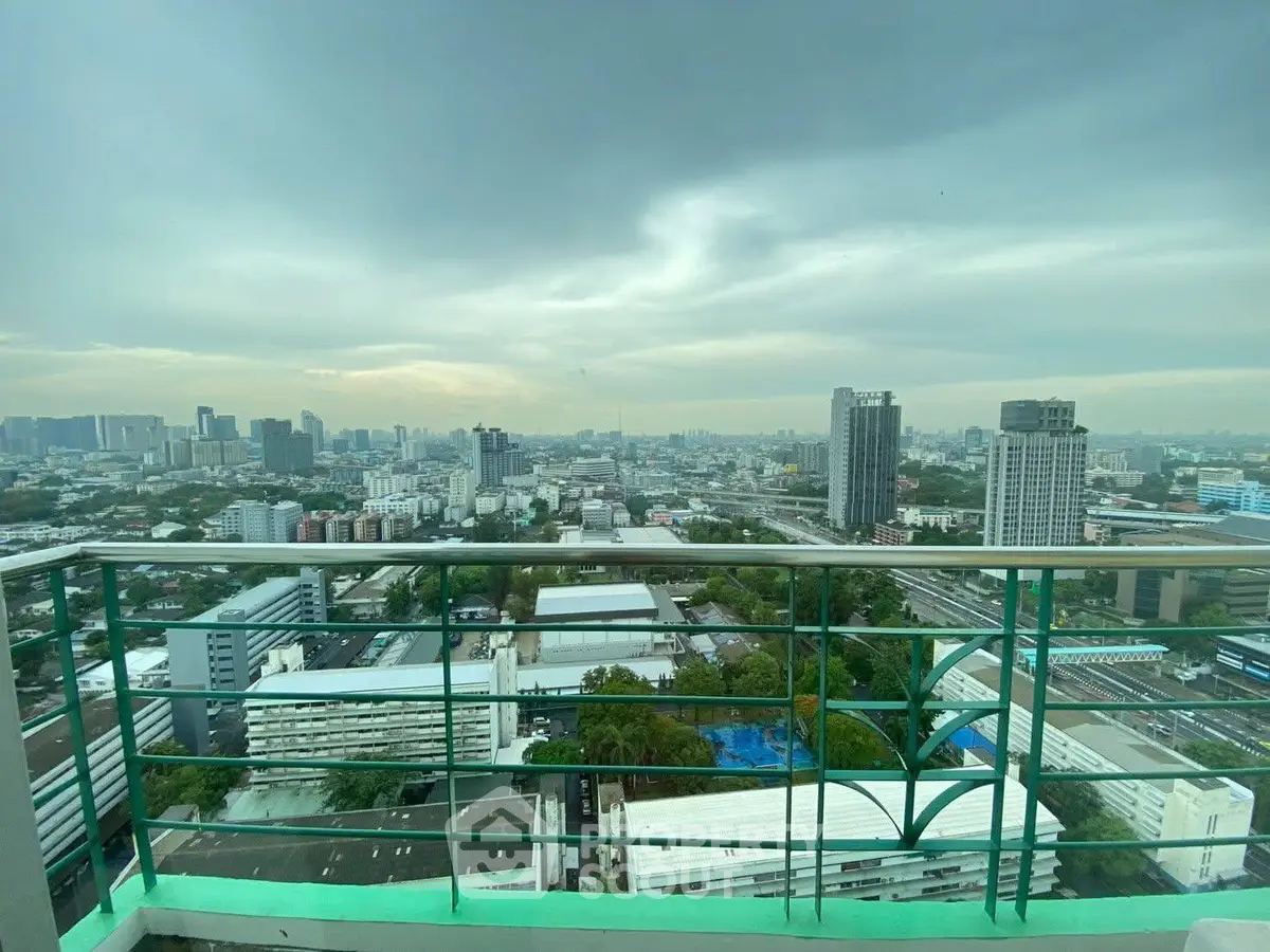 Stunning cityscape view from high-rise balcony with expansive skyline and urban landscape.