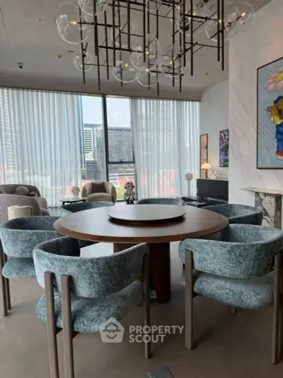 Luxurious modern living room with elegant round dining table and panoramic city view.