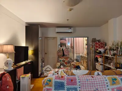 Cozy living room with colorful decor and air conditioning