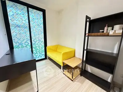 Cozy study room with yellow sofa and modern black desk