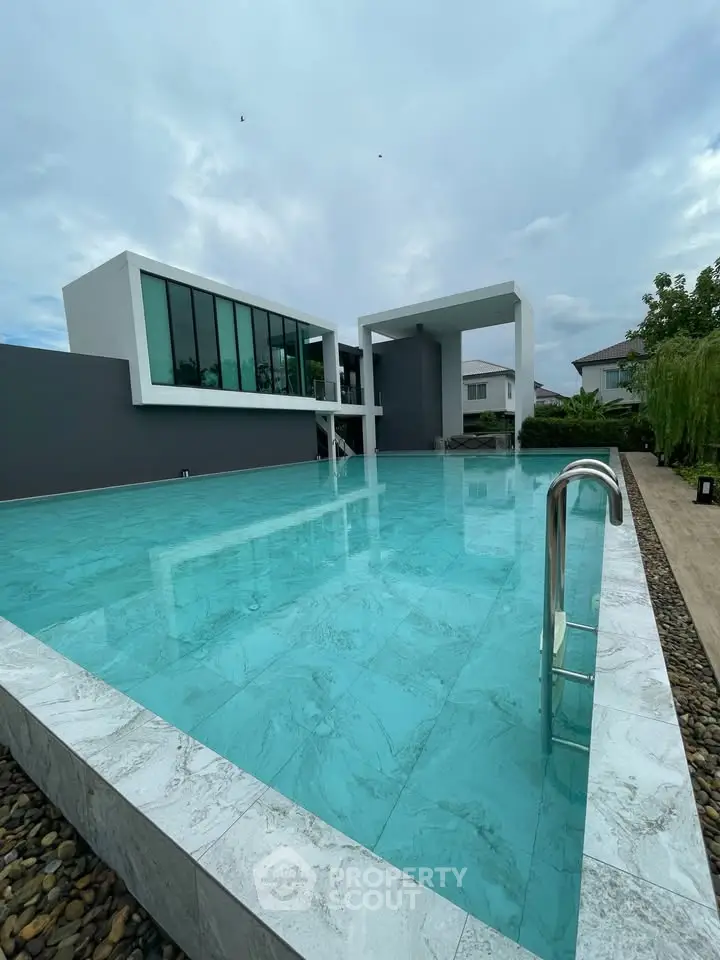 Luxurious modern home with stunning pool and sleek architecture.