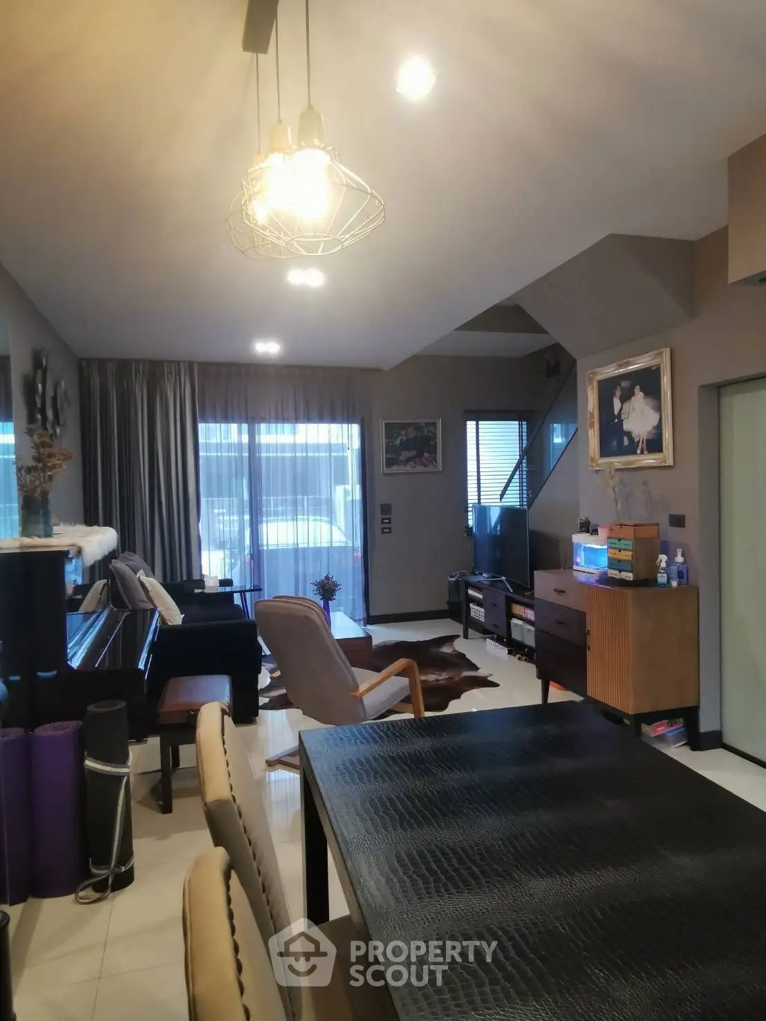 Modern living room with stylish decor and ample natural light