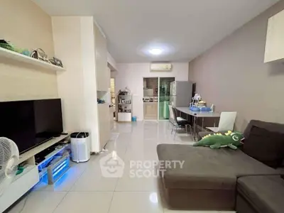 Modern living room with sleek furniture and open layout, perfect for cozy family gatherings.