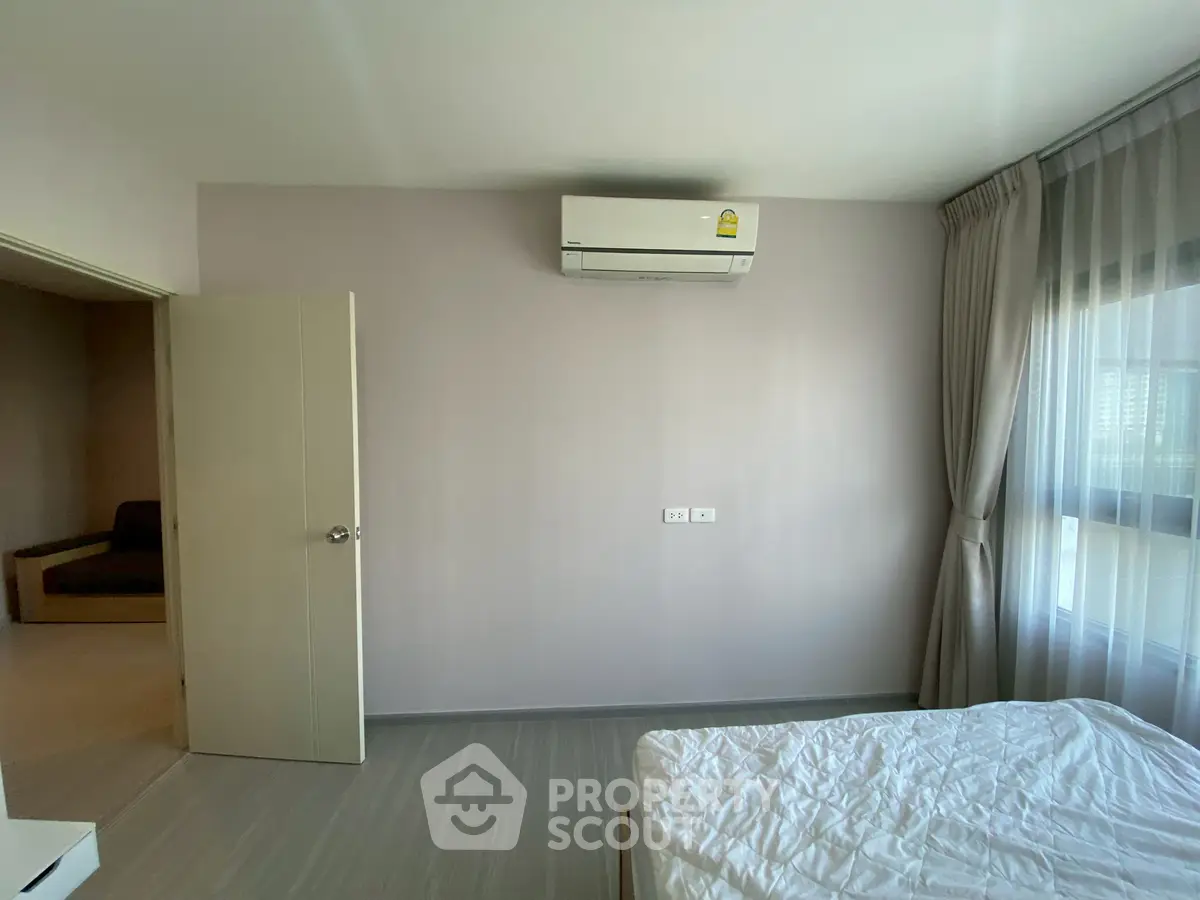 Modern bedroom with air conditioning and natural light