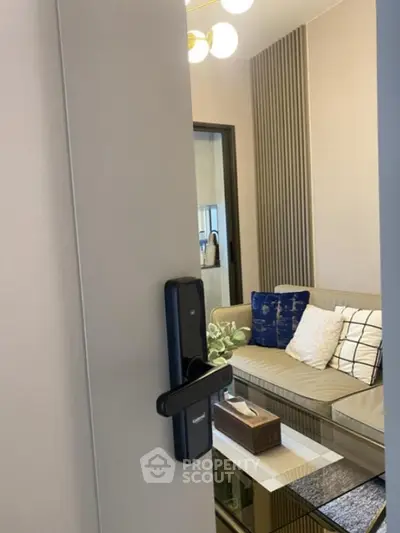 Modern living room with stylish decor and smart lock entry, perfect for urban living.