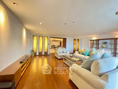 Spacious living room with elegant decor and wooden flooring