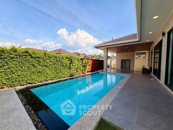 Luxurious modern home with private pool and spacious patio, perfect for relaxation and entertainment.