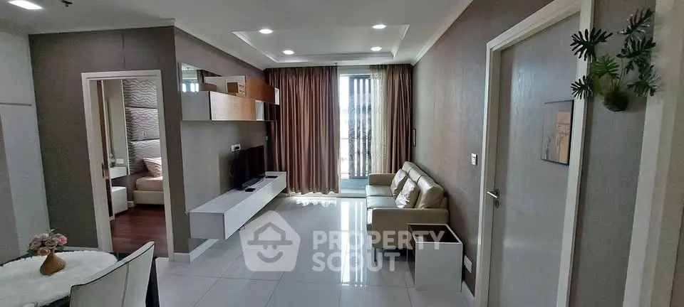 Modern living room with sleek design and natural light, featuring a cozy sofa and stylish decor.