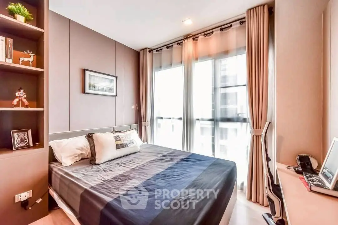 Modern bedroom with large windows and stylish decor in a high-rise apartment.