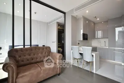 Modern open-plan living room with elegant kitchen and stylish decor