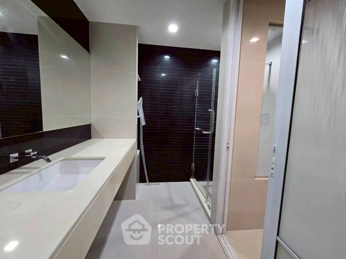 Modern bathroom with sleek design and spacious shower area