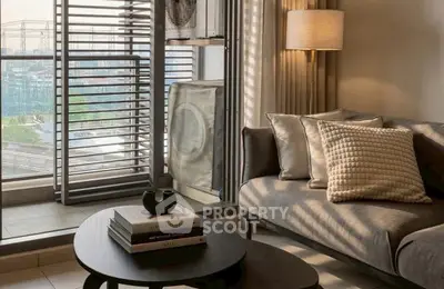 Stylish living room with modern decor and large windows offering city views.