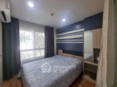 Cozy bedroom with modern decor and large window for natural light