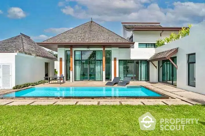 Luxurious modern villa with private pool and lush garden, perfect for serene living.