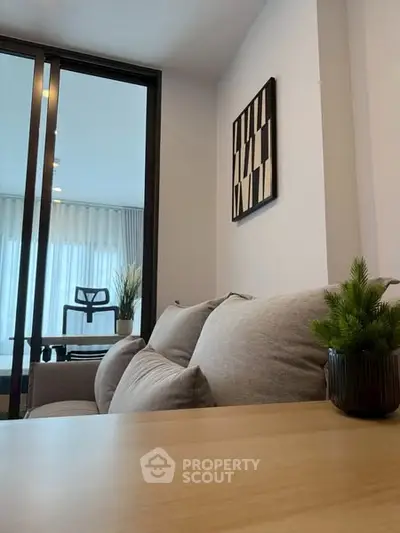 Modern living room with stylish decor and cozy seating area.