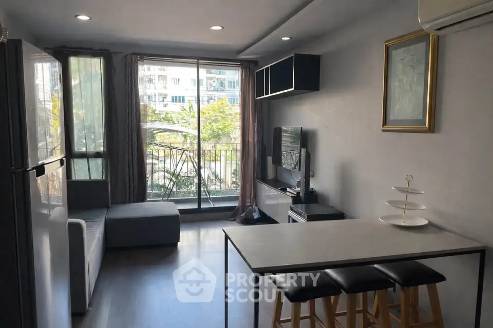 Modern living room with balcony view and sleek interior design