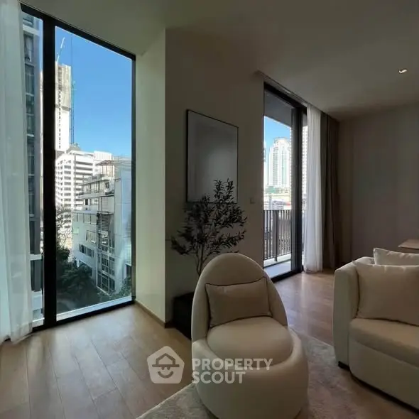 Modern living room with floor-to-ceiling windows and city view