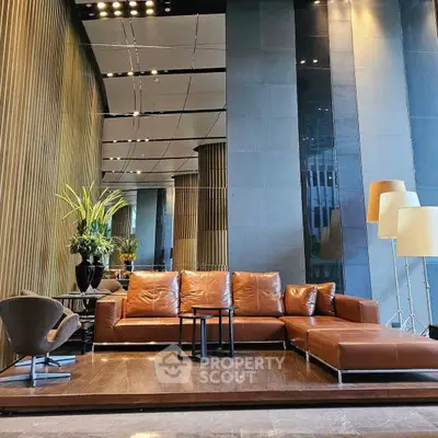 Luxurious modern living room with leather sofa and elegant decor in a high-end apartment.