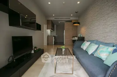 Modern living room with stylish decor and open kitchen layout