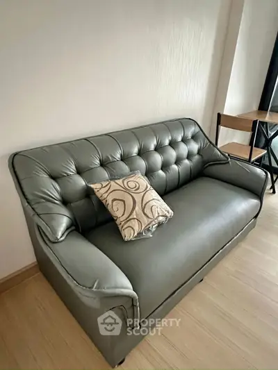 Modern living room with stylish leather sofa and elegant decor